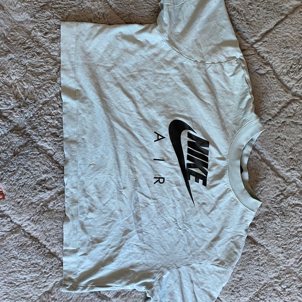 it is a baby blue Nike shirt the fabric quality is soft